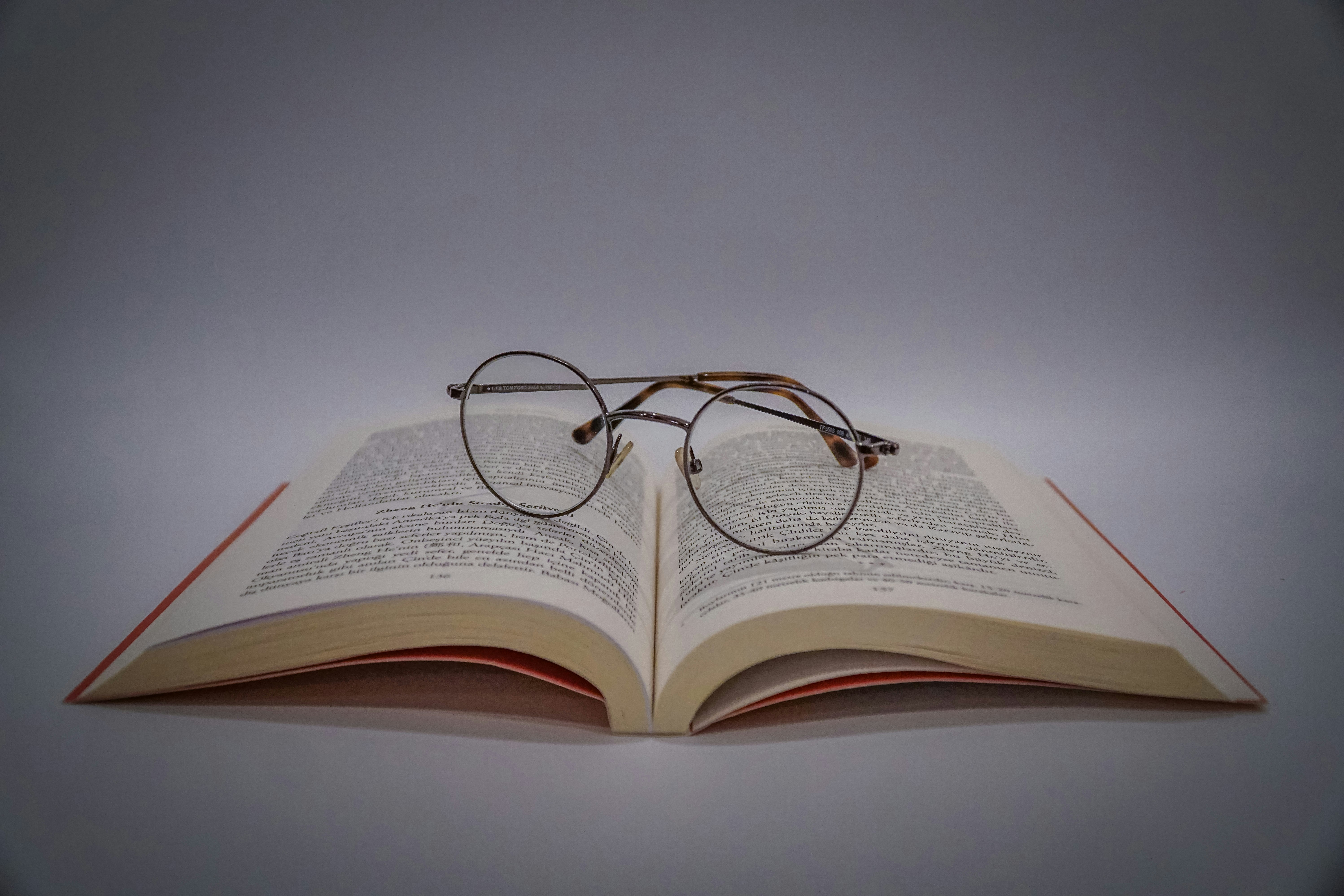 <figcaption>Book reviewer with his glasses</figcaption>