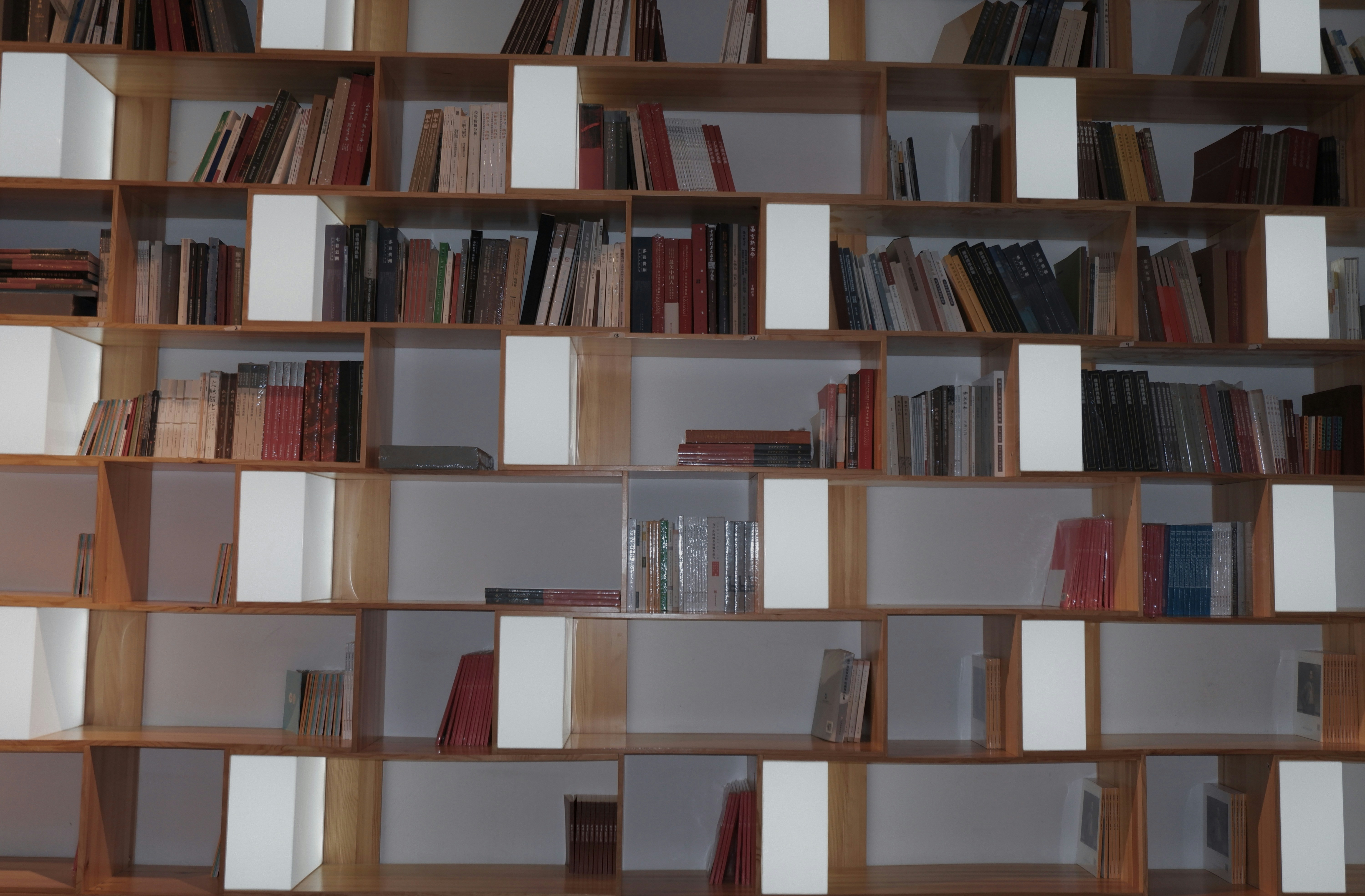 <figcaption>Bookshelf with with a few missing pieces.</figcaption>